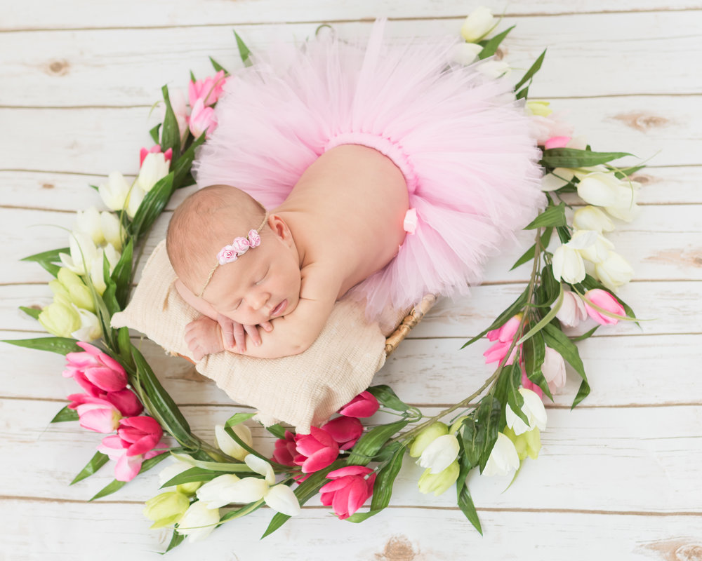 Sweet Baby Riley surrounded by flowers that were a part of her parents' engagement!