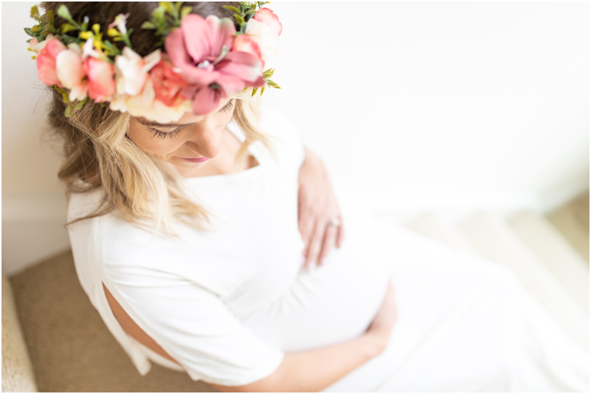 Maternity Shot focused on baby bump with white dress
