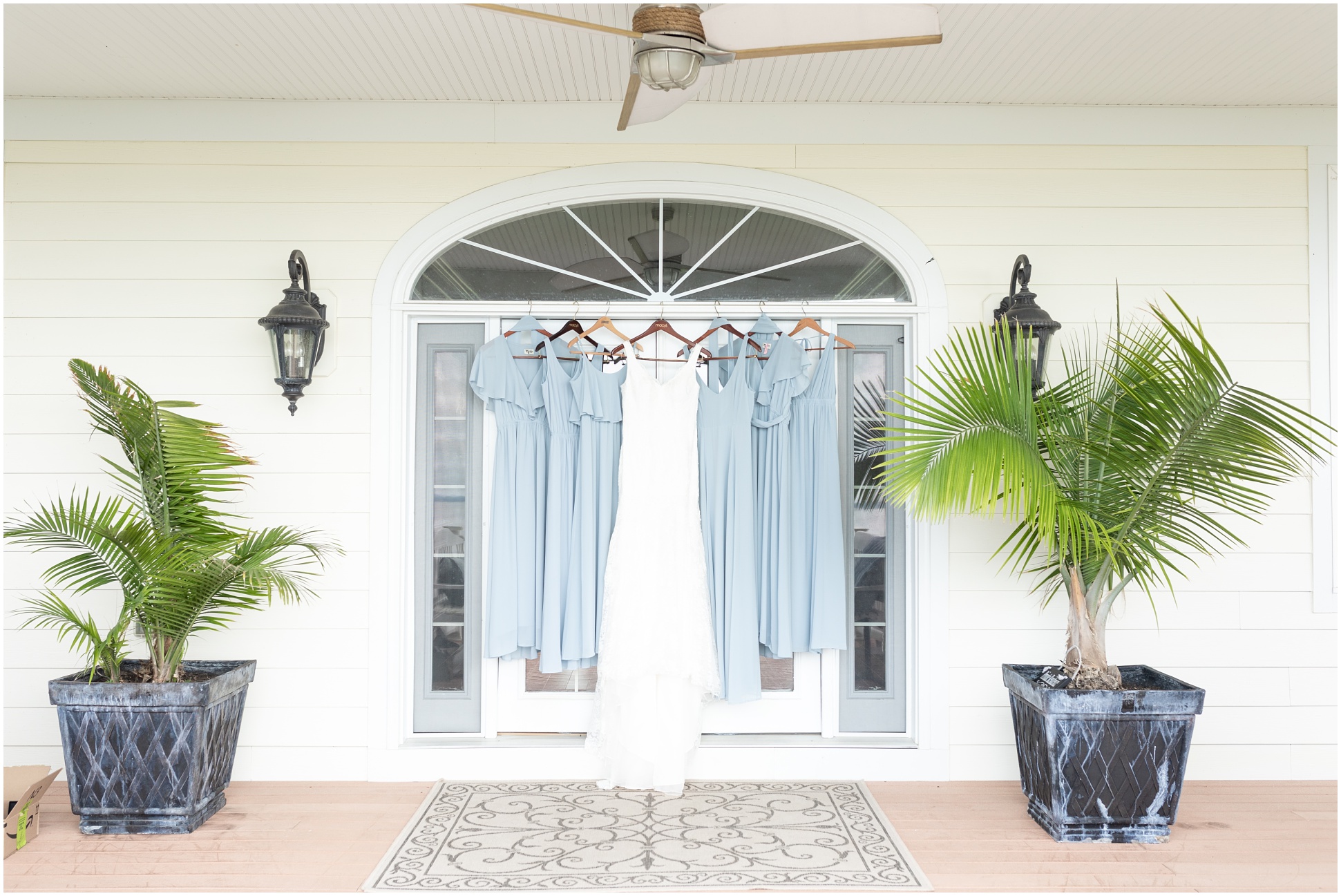 Blue love your mumu bridesmaids dresses with the gown hanging in front of door