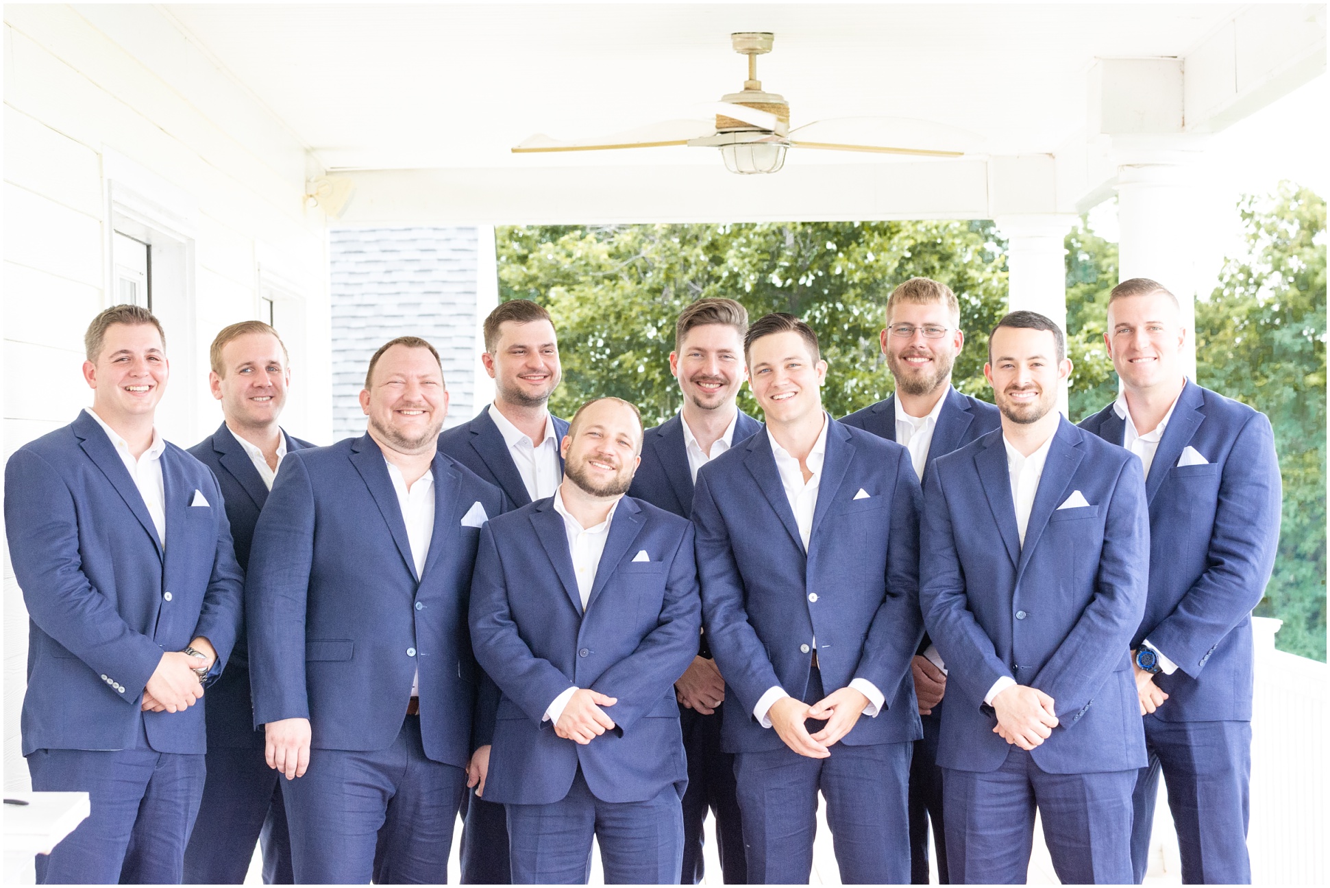 Groomsmen and Groom together on the porch