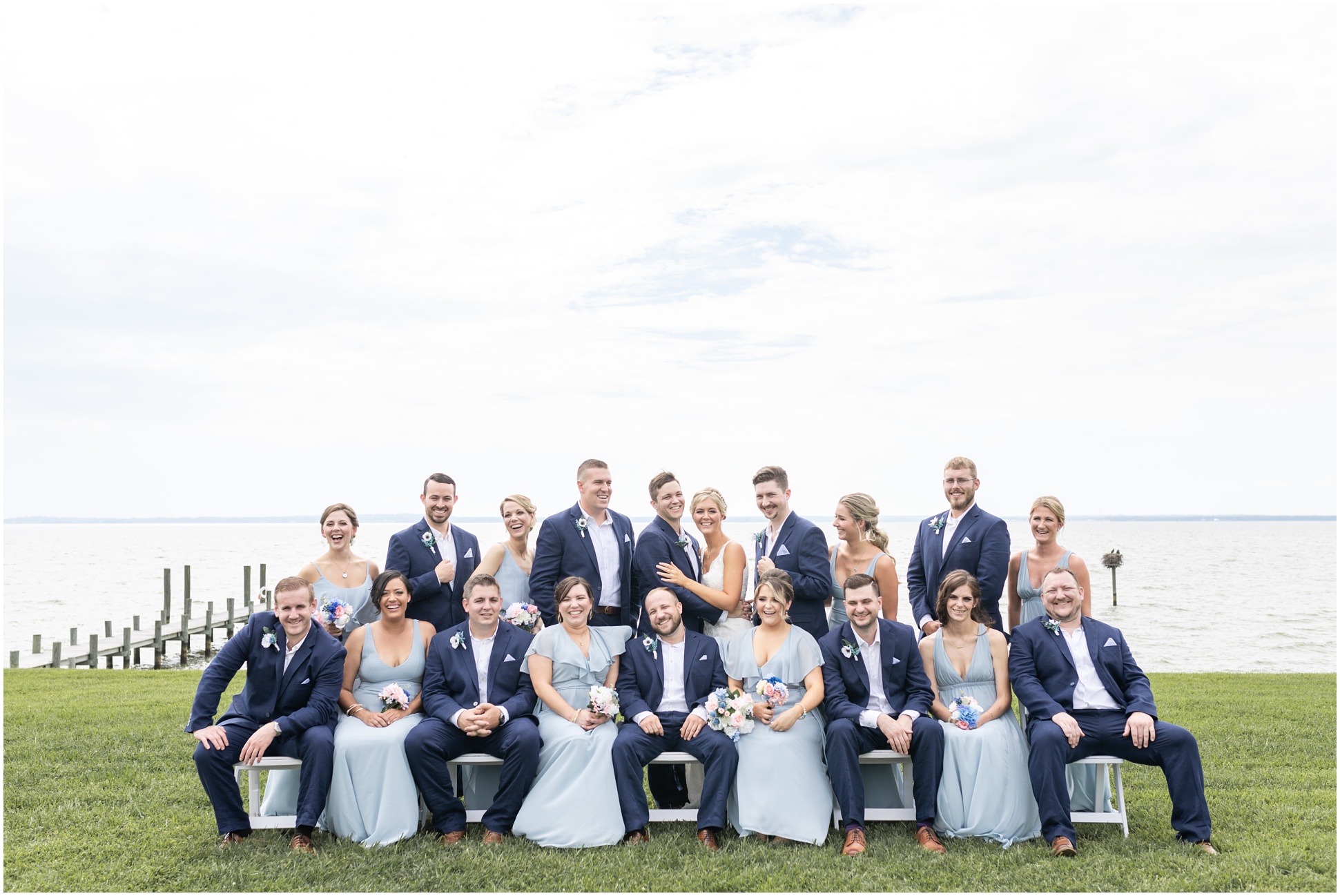 Full bridal party by the water at weatherly farm