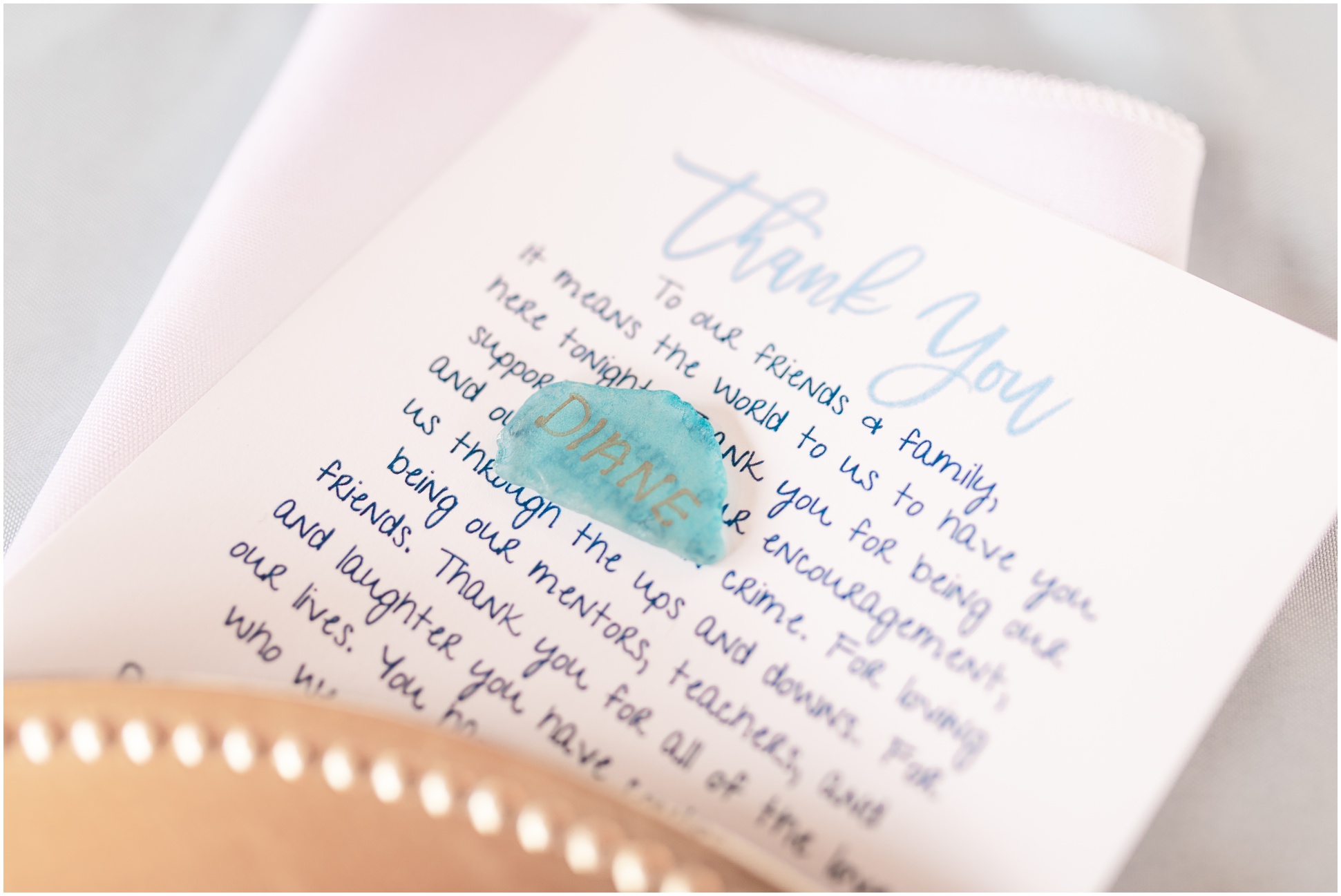 detailed image of the thank you note and the stone name marker