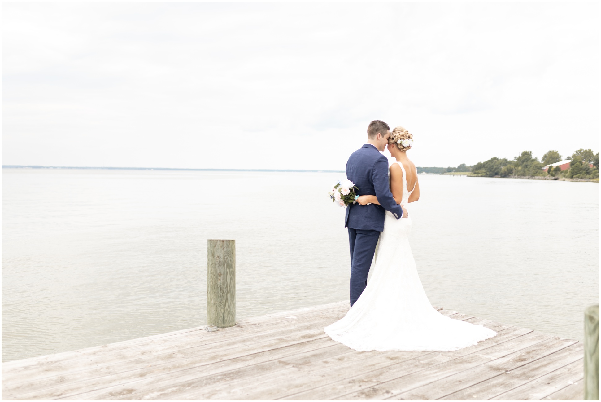 Bride and groom on the dock for bridal portraits