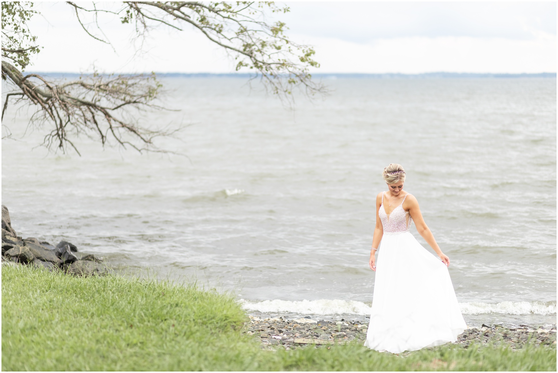 bride on the beach at weatherly farms with her dress blowing in the wind