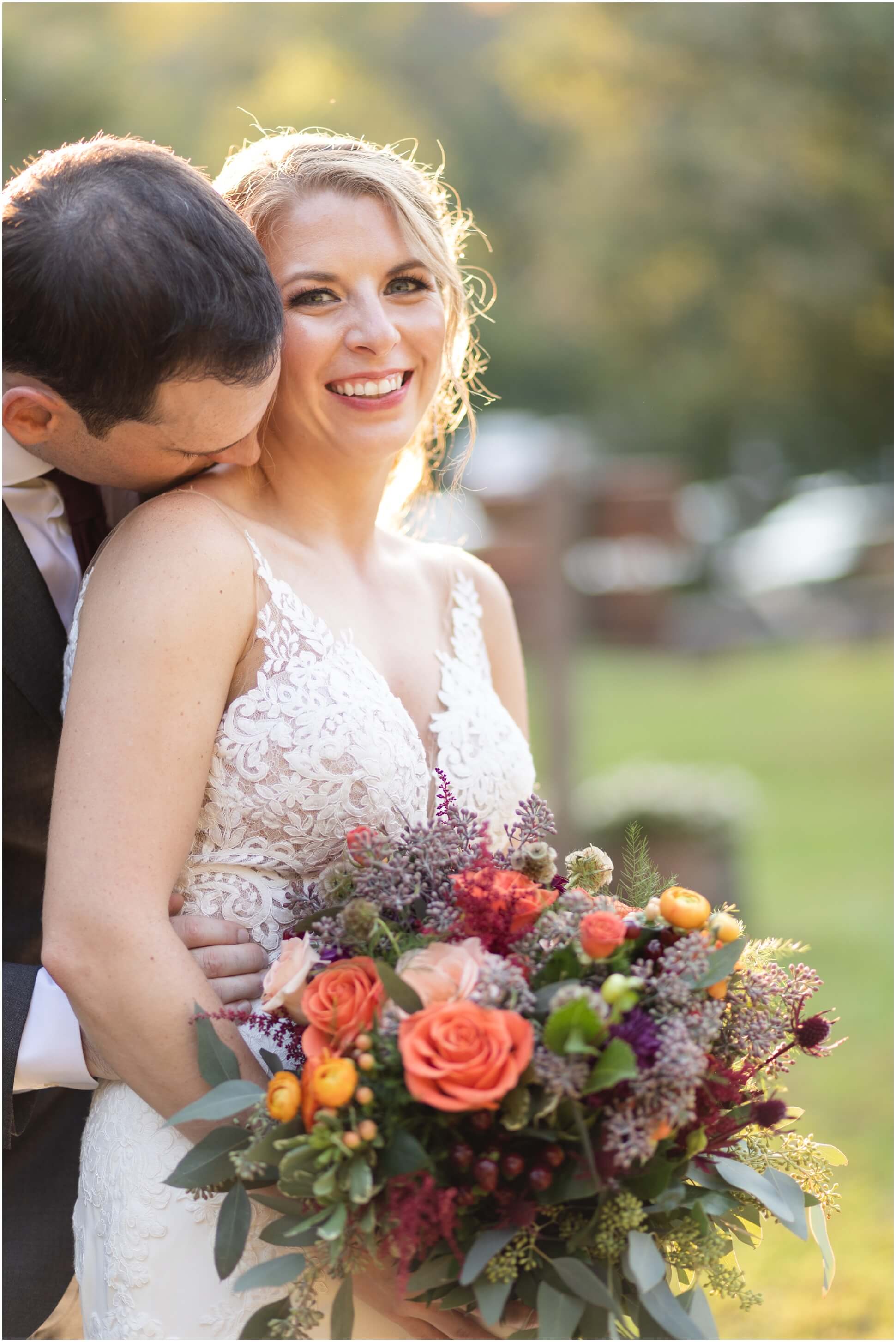 GROOM NUZZLING INTO BRIDE'S NECK