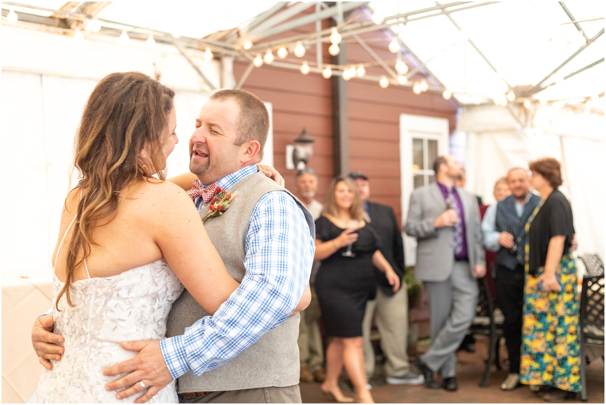 Husband and Wife sining to each other during first dance at Manor Tavern