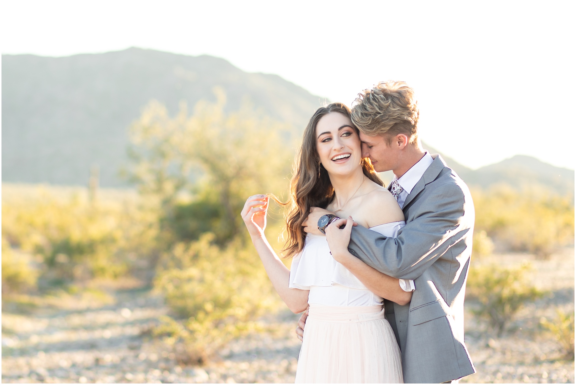 Bride and Groom Playing Around at Estrella Mountain Engagement Session