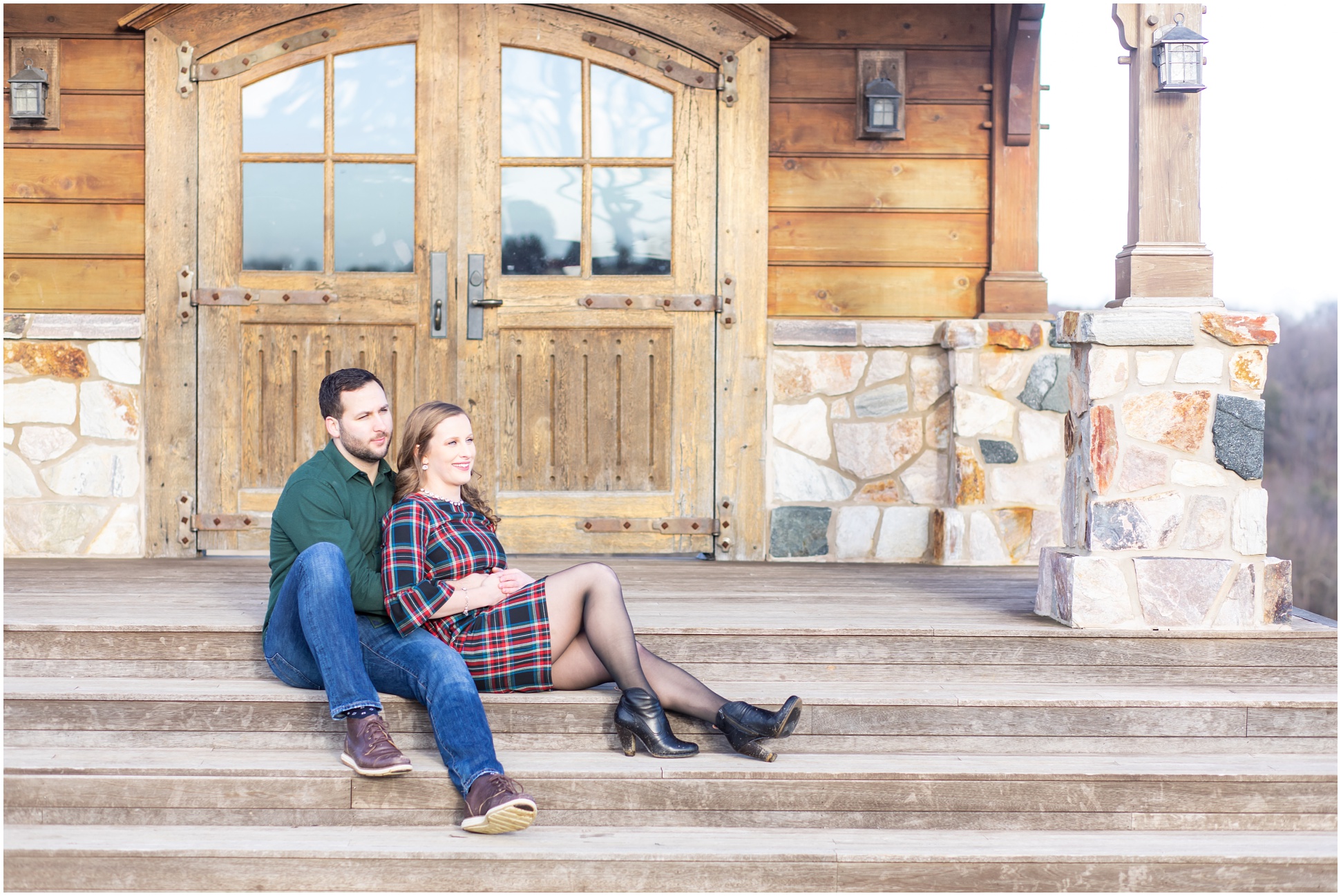 groom wearing jeans and a winter green button down shirt, bride wearing plaid dress and black booties