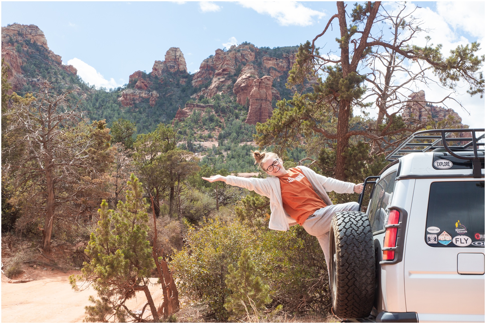 Katlyn hanging off the back of the RangeRover on Schnebly trail