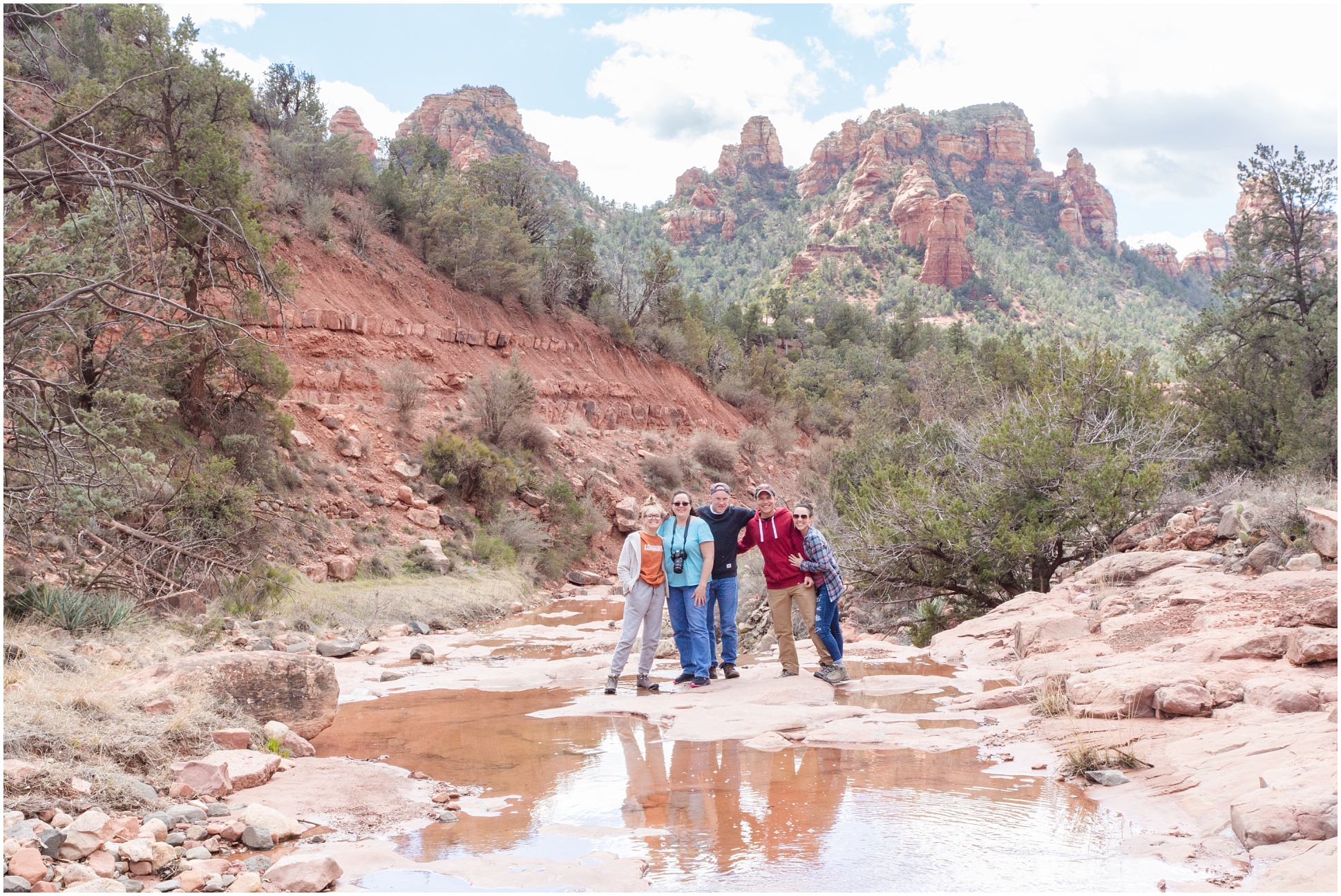 Family Photo with the reflection in the creek at Schnebly Hill in Sedona, Arizona