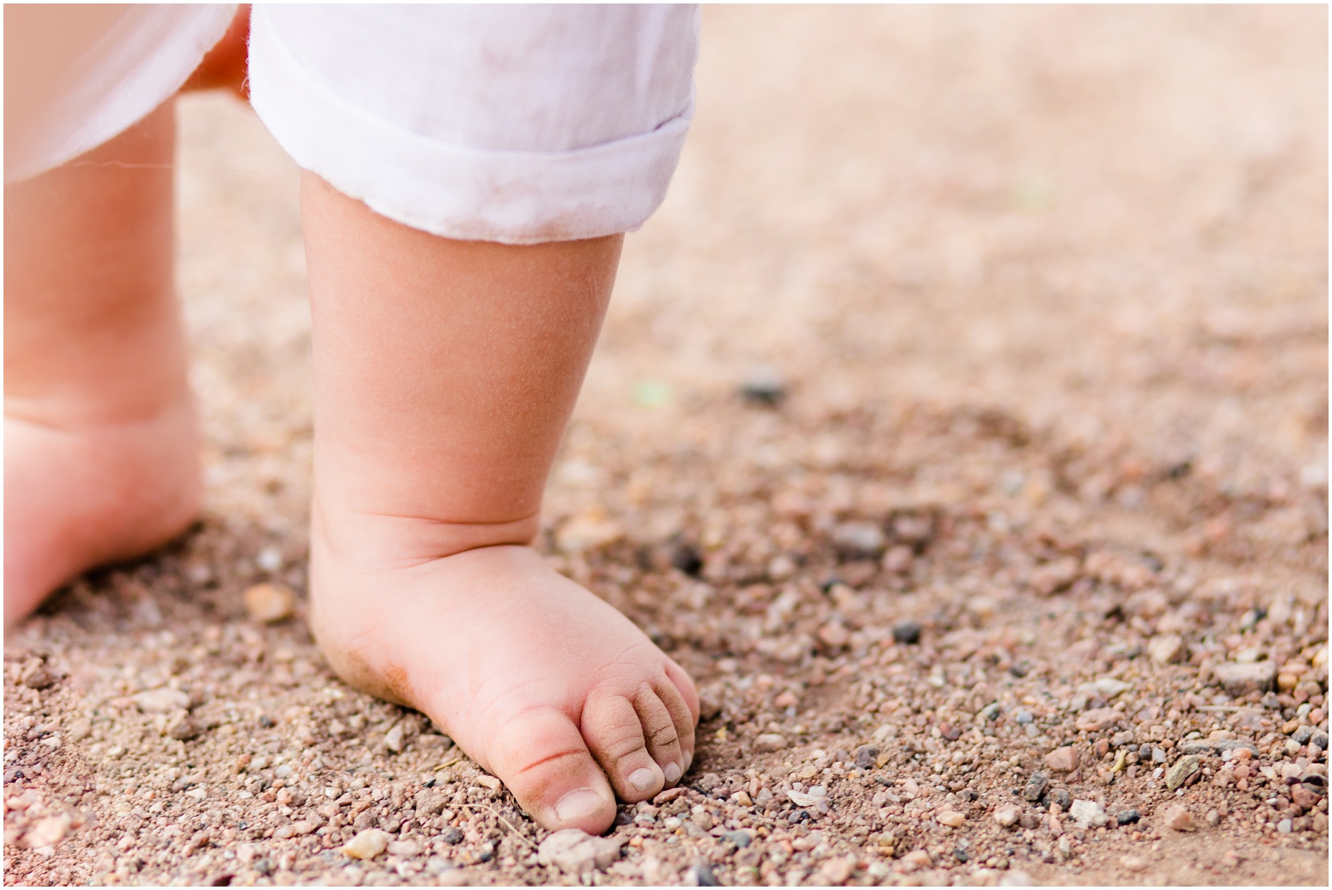 Karsyn's toes playing in the dirt at his first birthday portraits