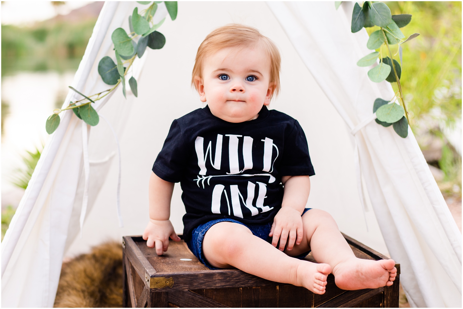 Karsyn making a smug face at the camera for his first birthday portraits