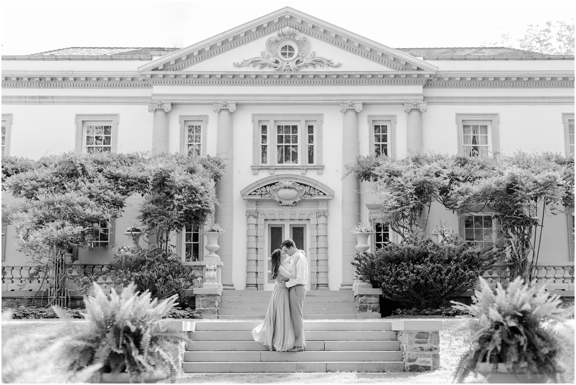 Black and White Photograph of Angela and Jeff standing in front of the Liriodendron Mansion