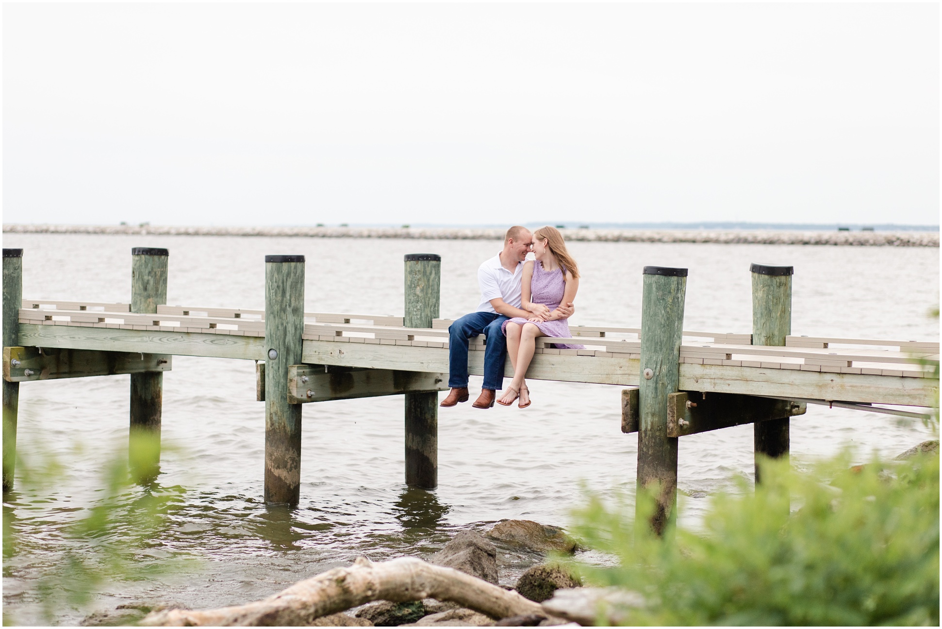 Couple sitting on a pier at North Point State Park