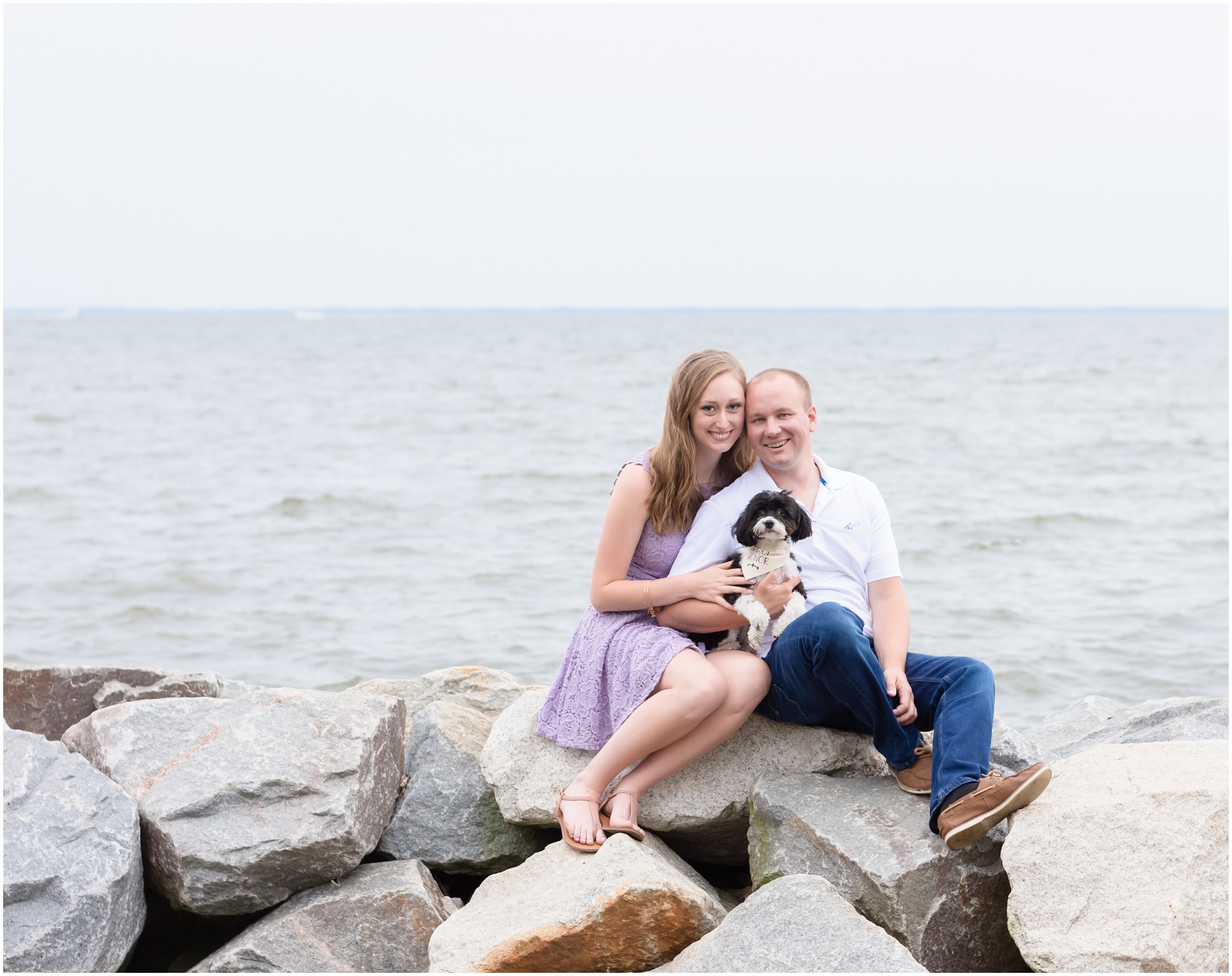 Family photo with puppy on the rocks