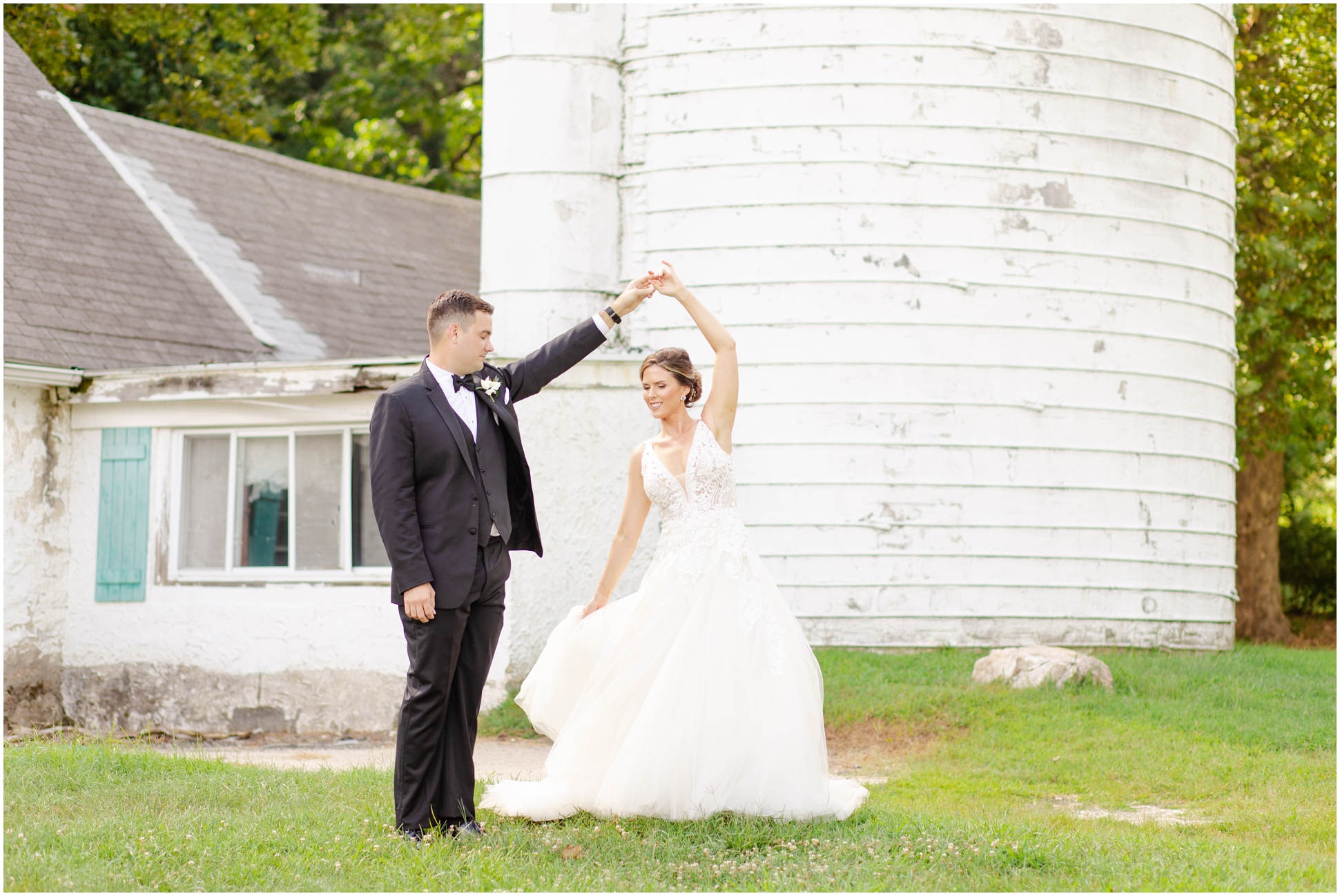 Angela and Jeff twirling next to the silo on Eagles Nest Country Club golf course
