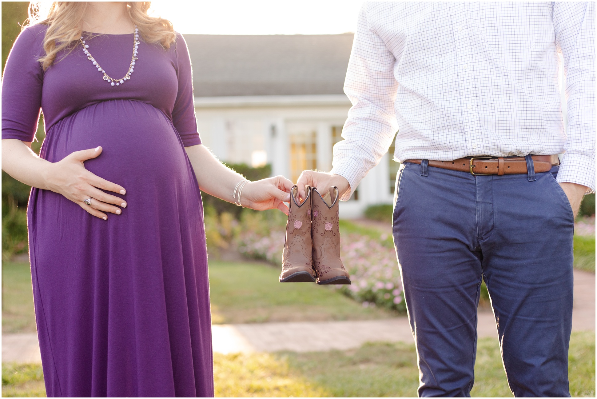 Maternity Session inspiration where parents to be are holding little cowgirl boots