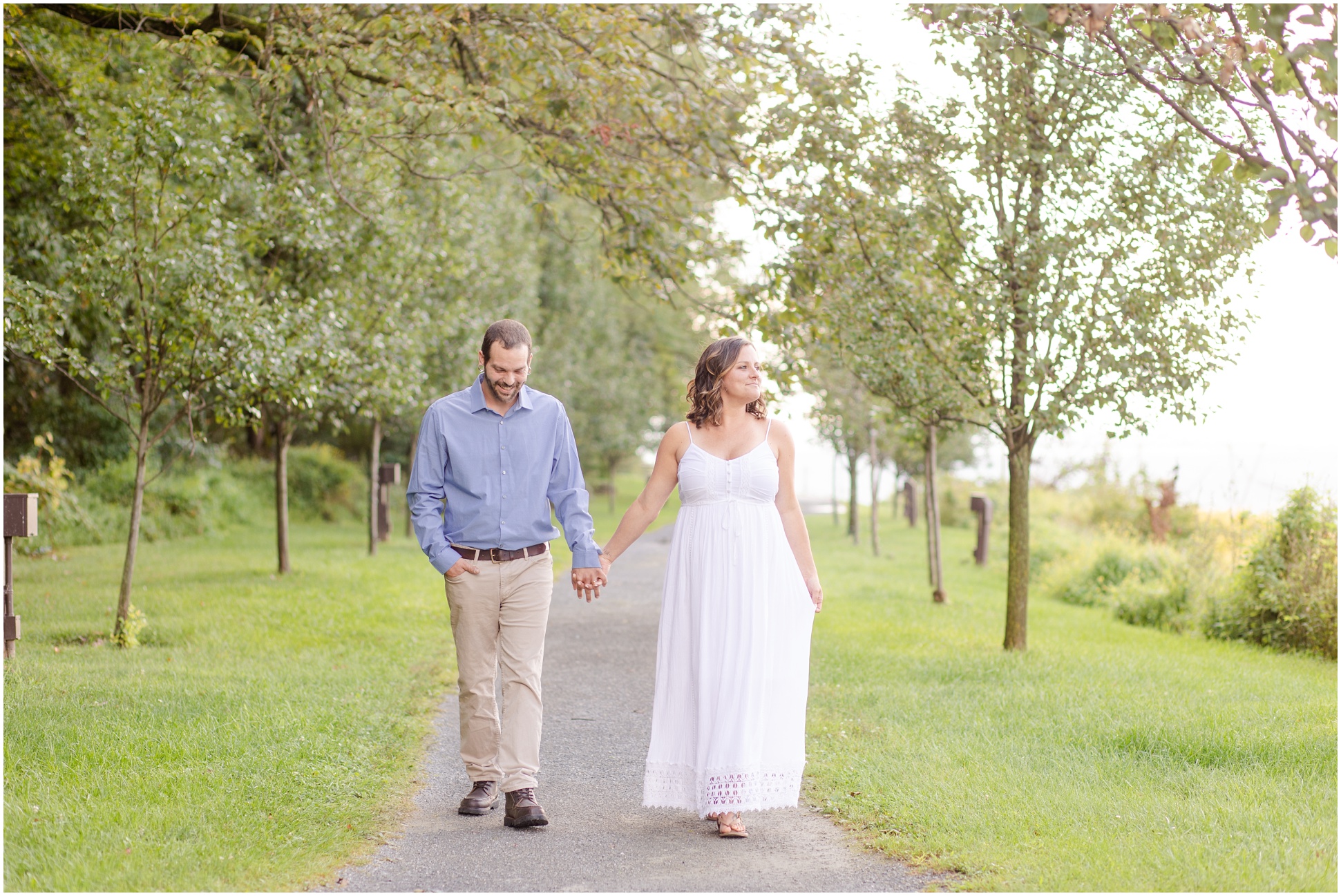 Jimmy and Mallory walking down the path, hand in hand, at Rocky Ridge Park in PA