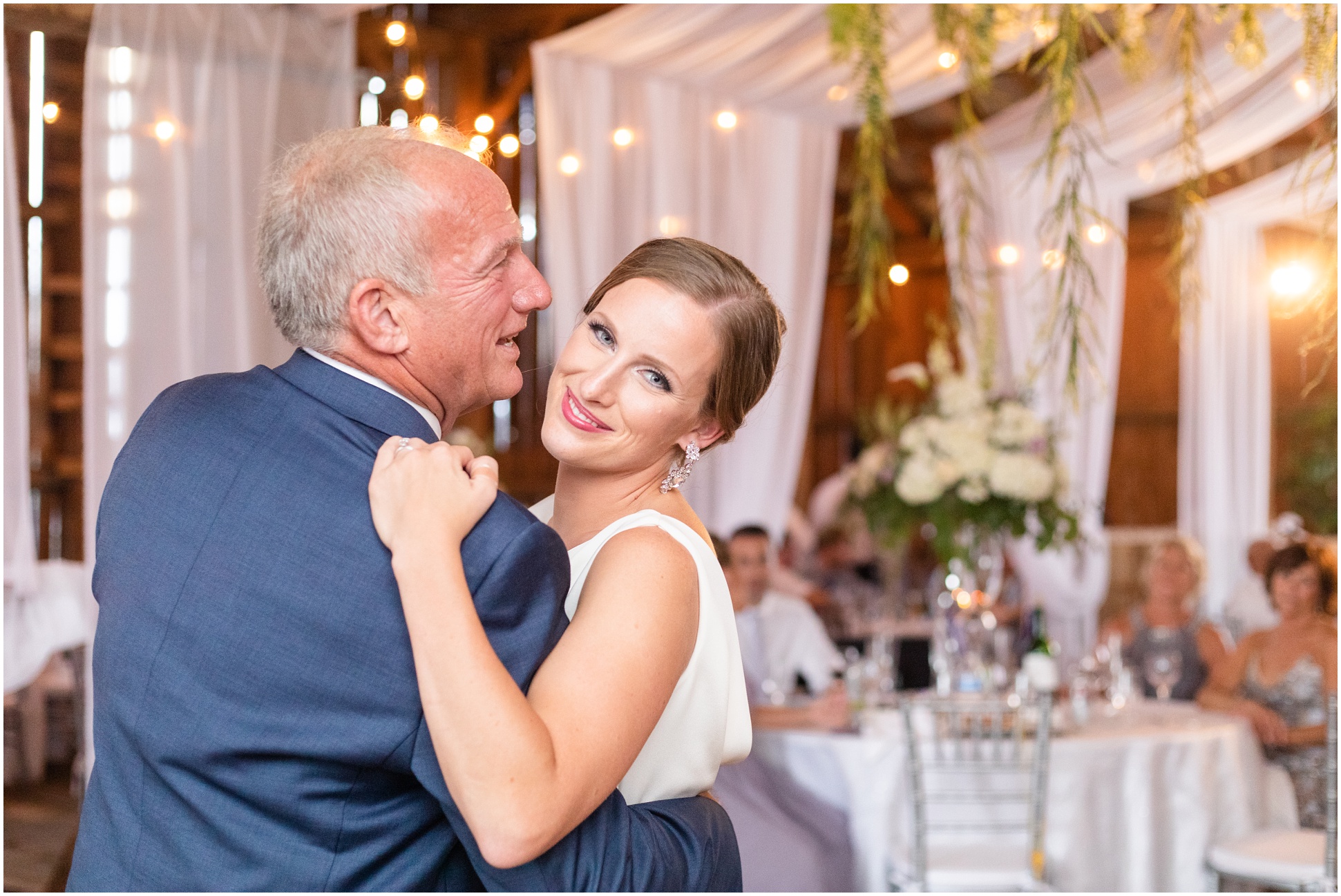 The bride dancing with her dad during the father-daughter dance