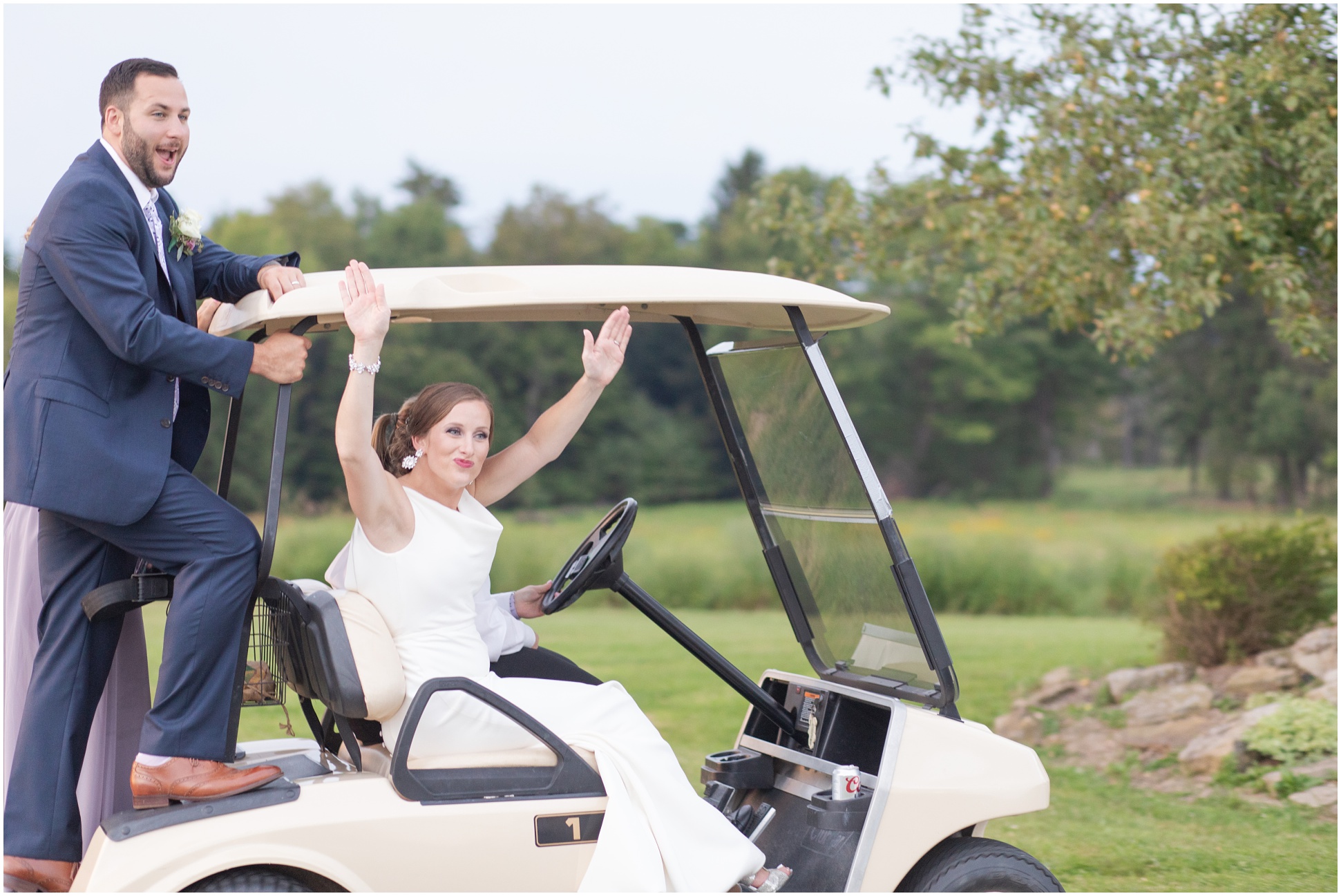 Bride and groom riding on a golf cart on the Magley estate