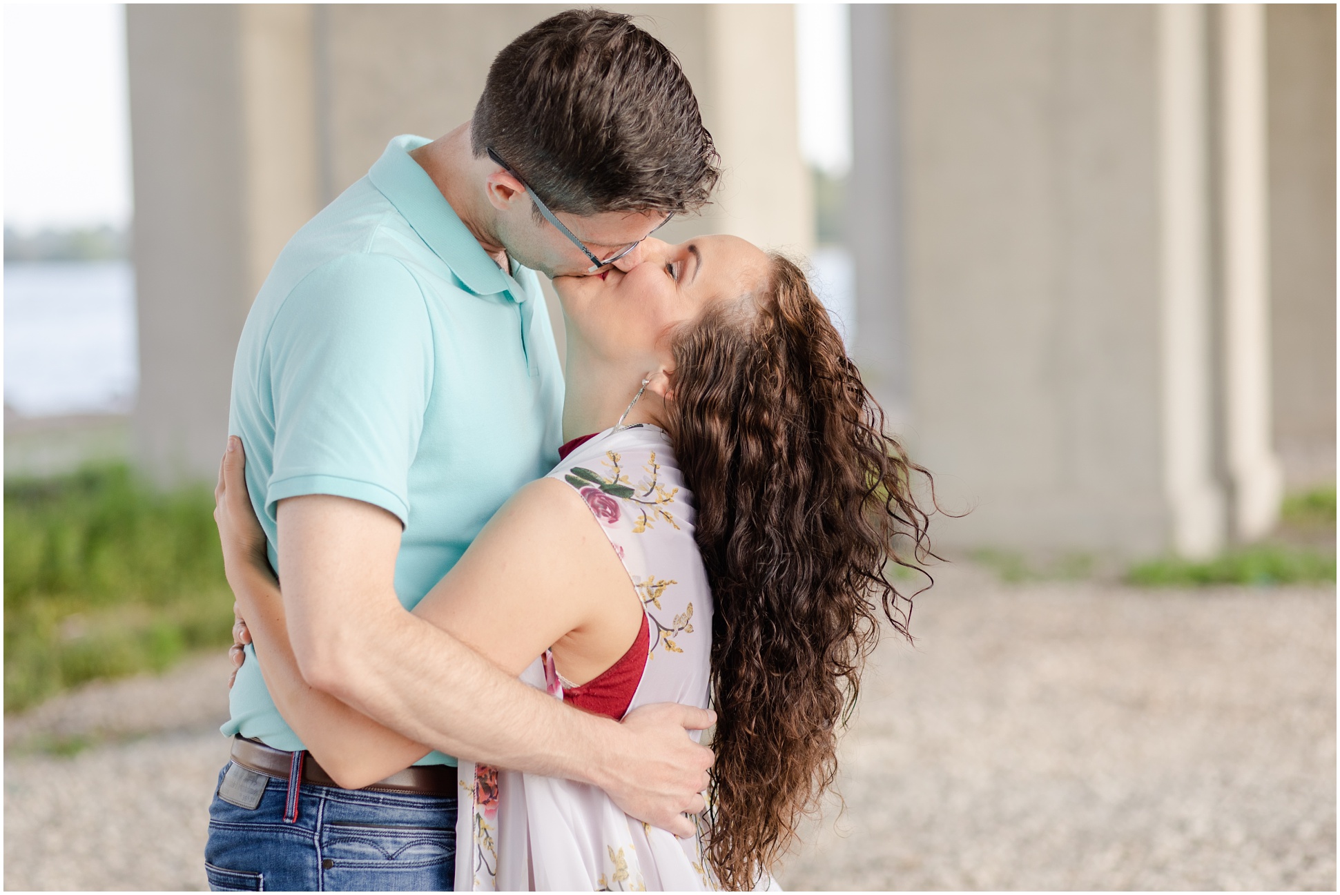 Engaged Couple Kissing under the bridge