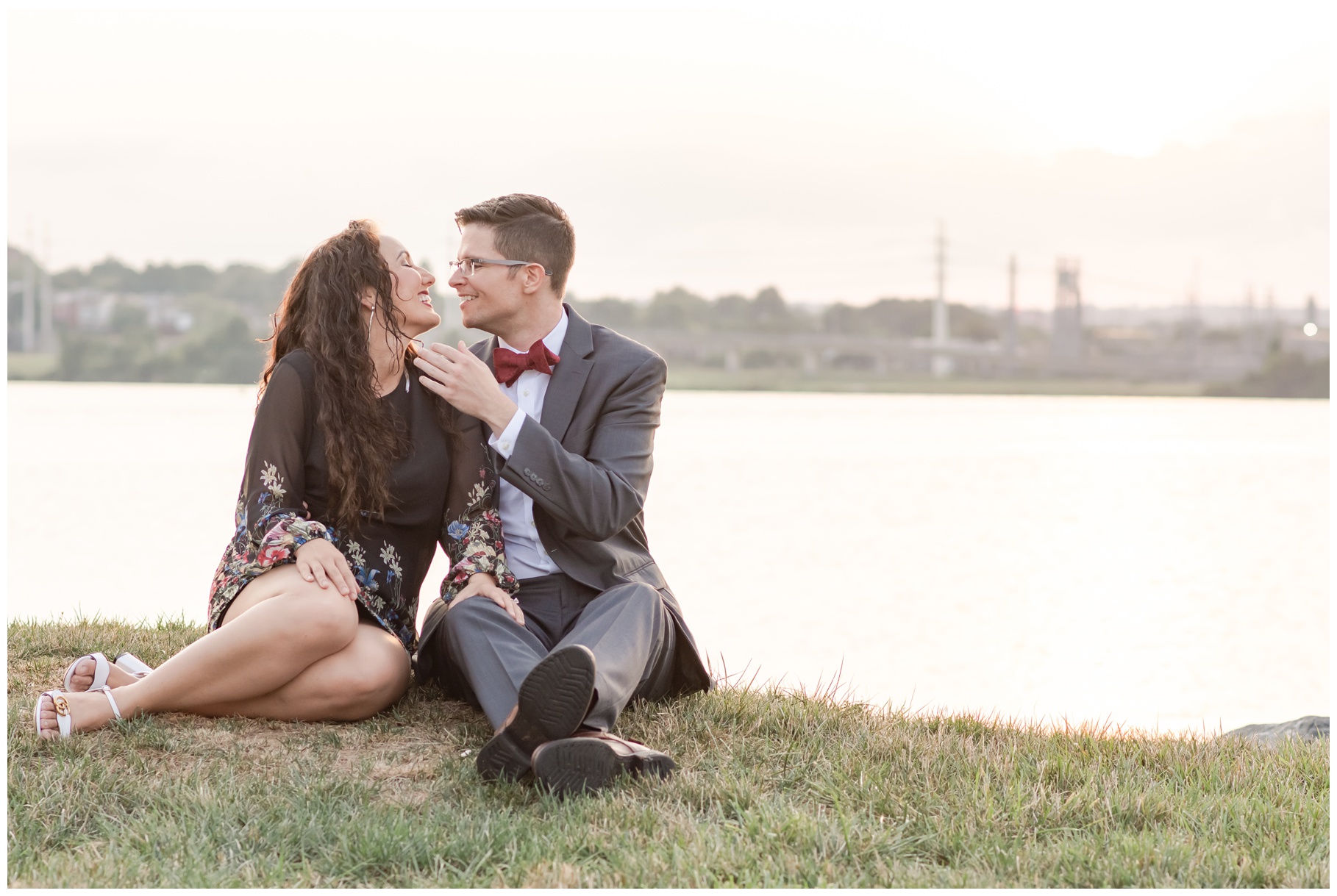 Engagement session - couple kissing on riverbank