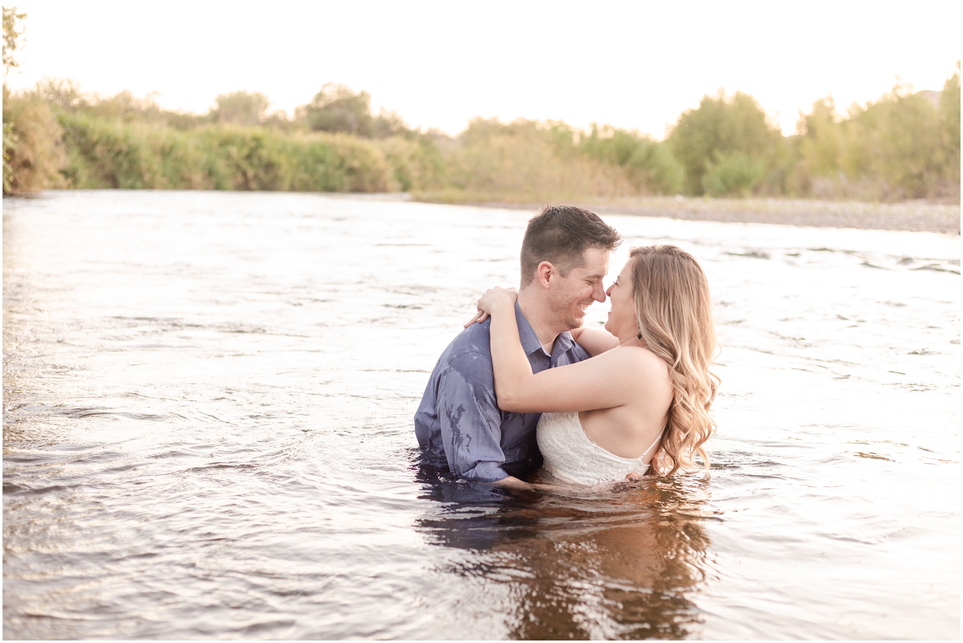 man and woman hugging chest deep in salt river