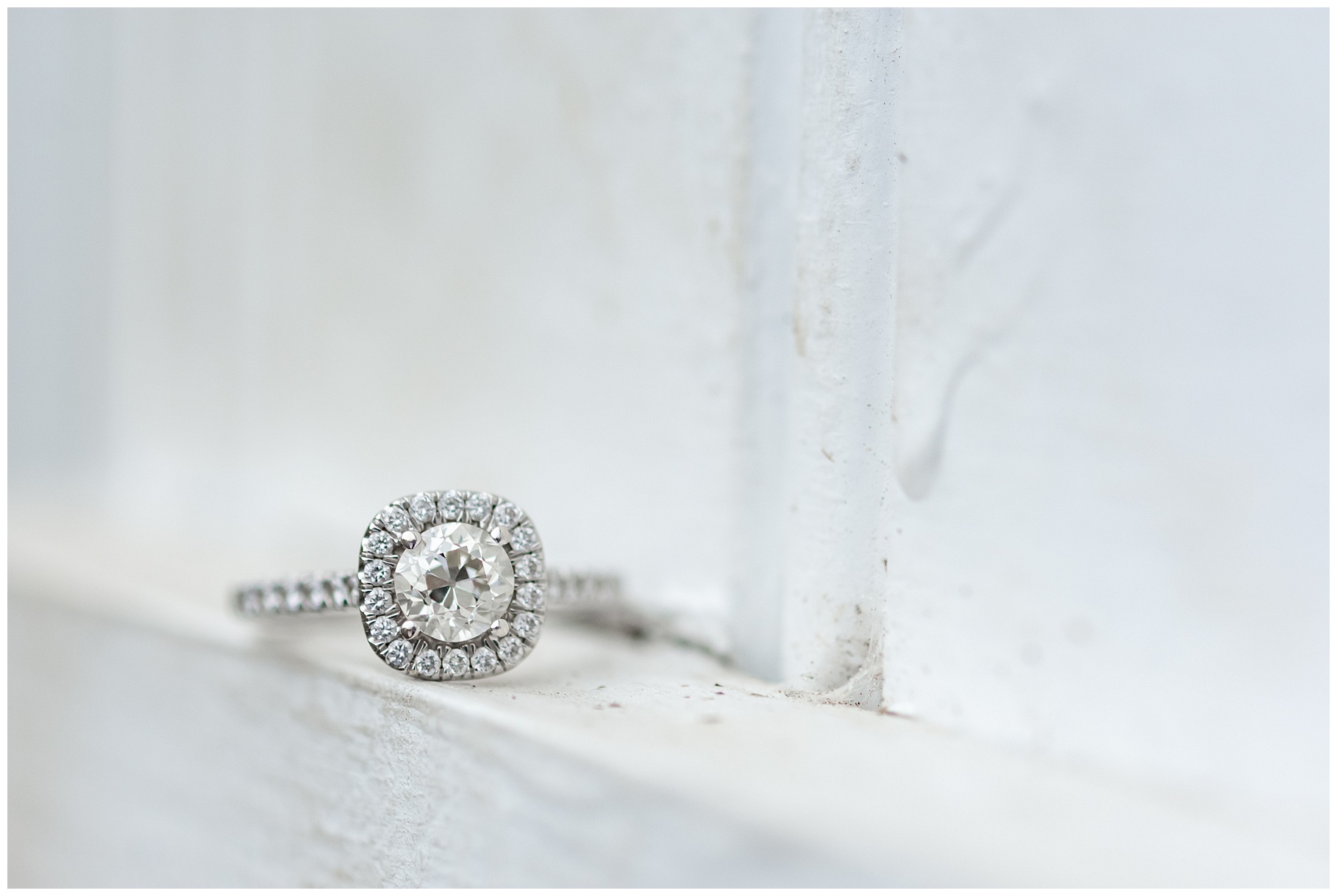 Engagement ring on white barn door