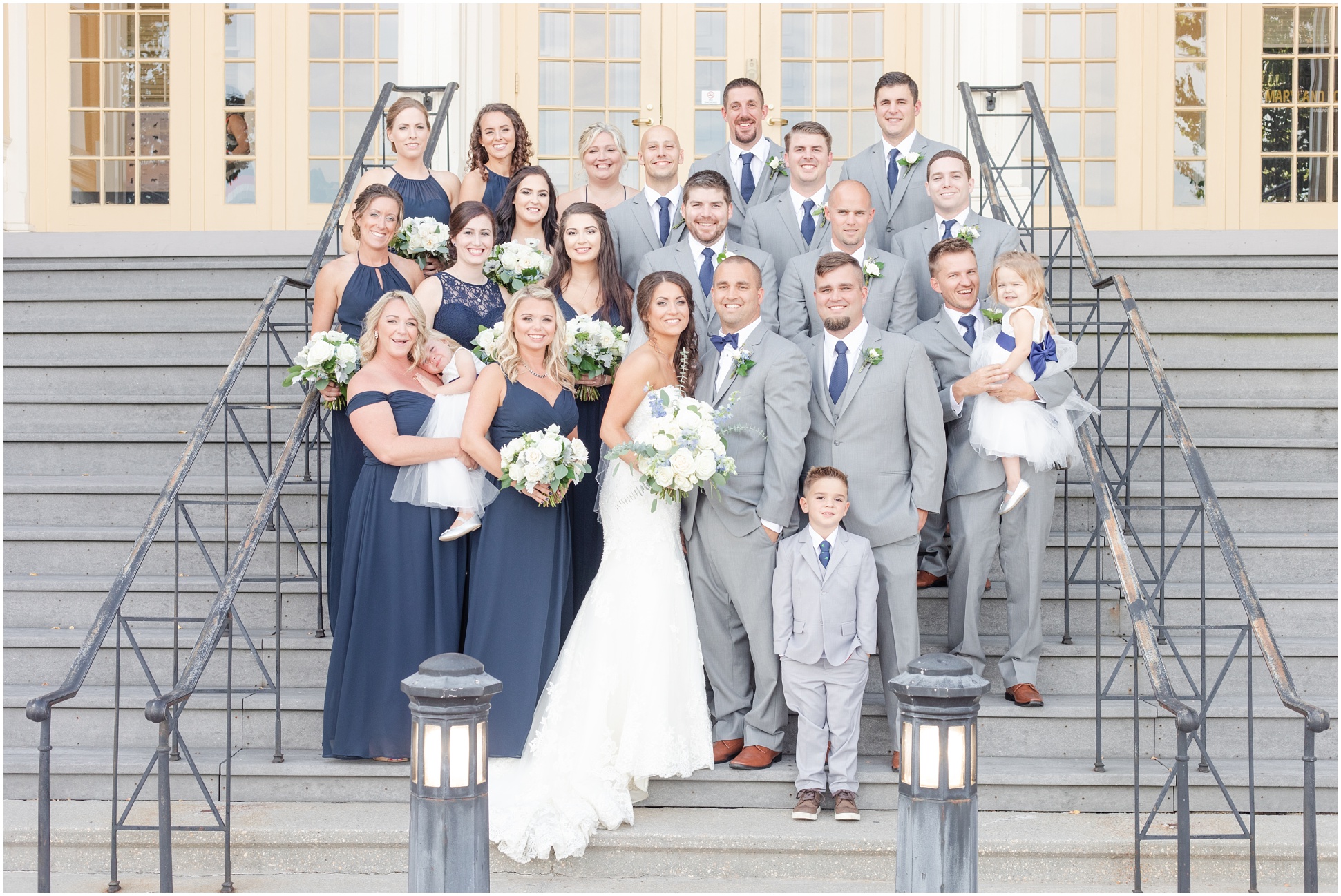 The Heaps Bridal Party standing on the stairs of the mansion on the property of the Maryland Zoo