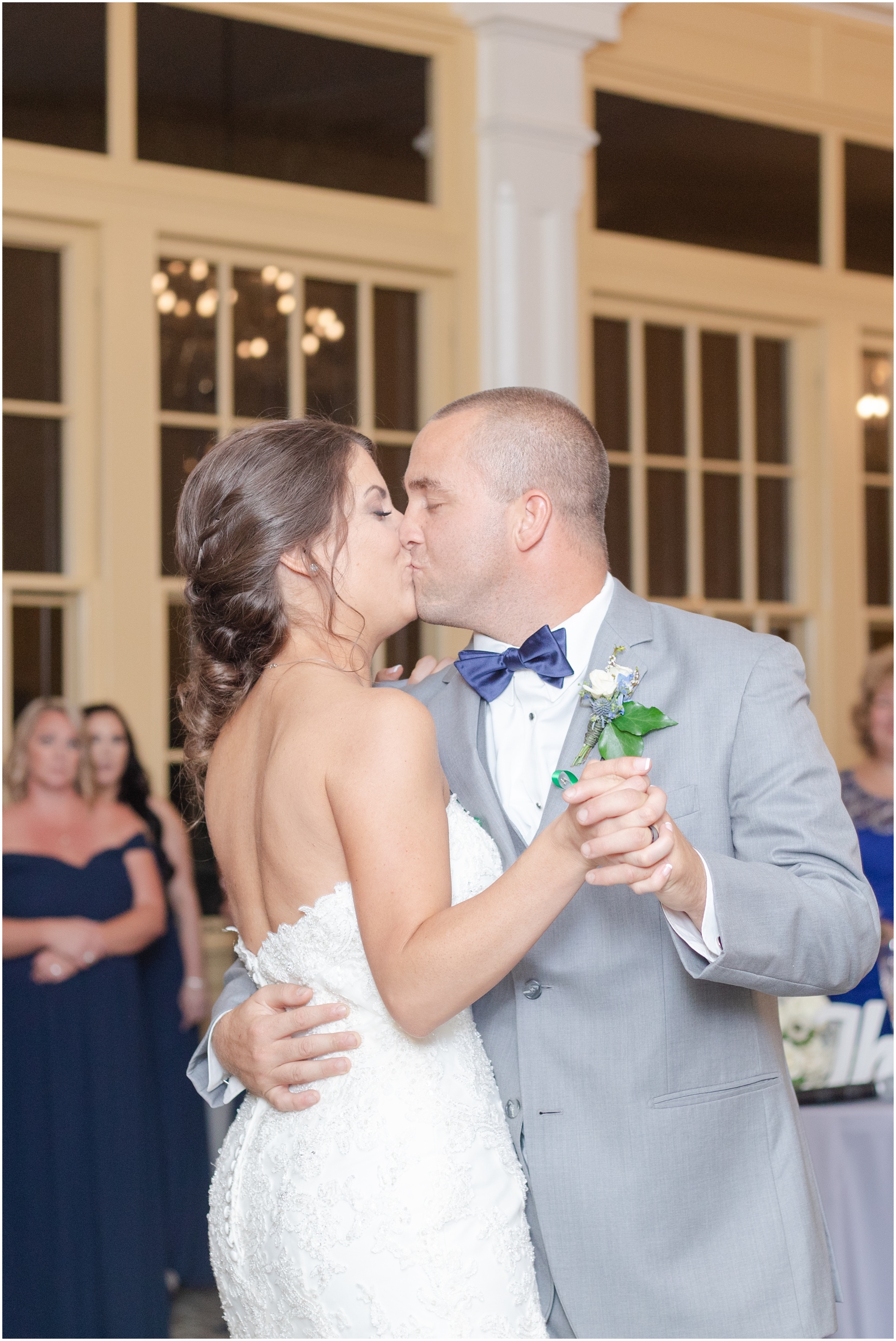 Bride and groom kissing as they ended their first dance on their wedding day at the MD Zoo