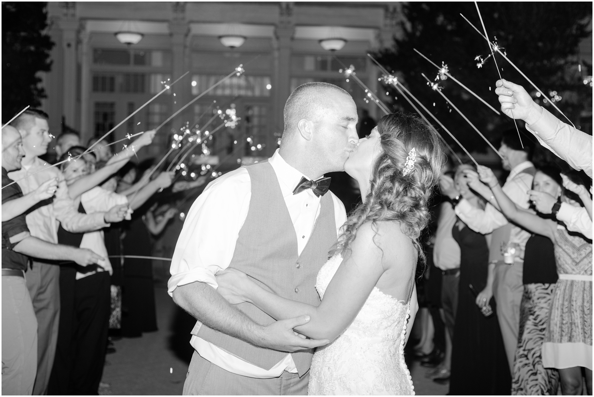 Valarie and Ryan kissing under their sparklers as they exited their reception 