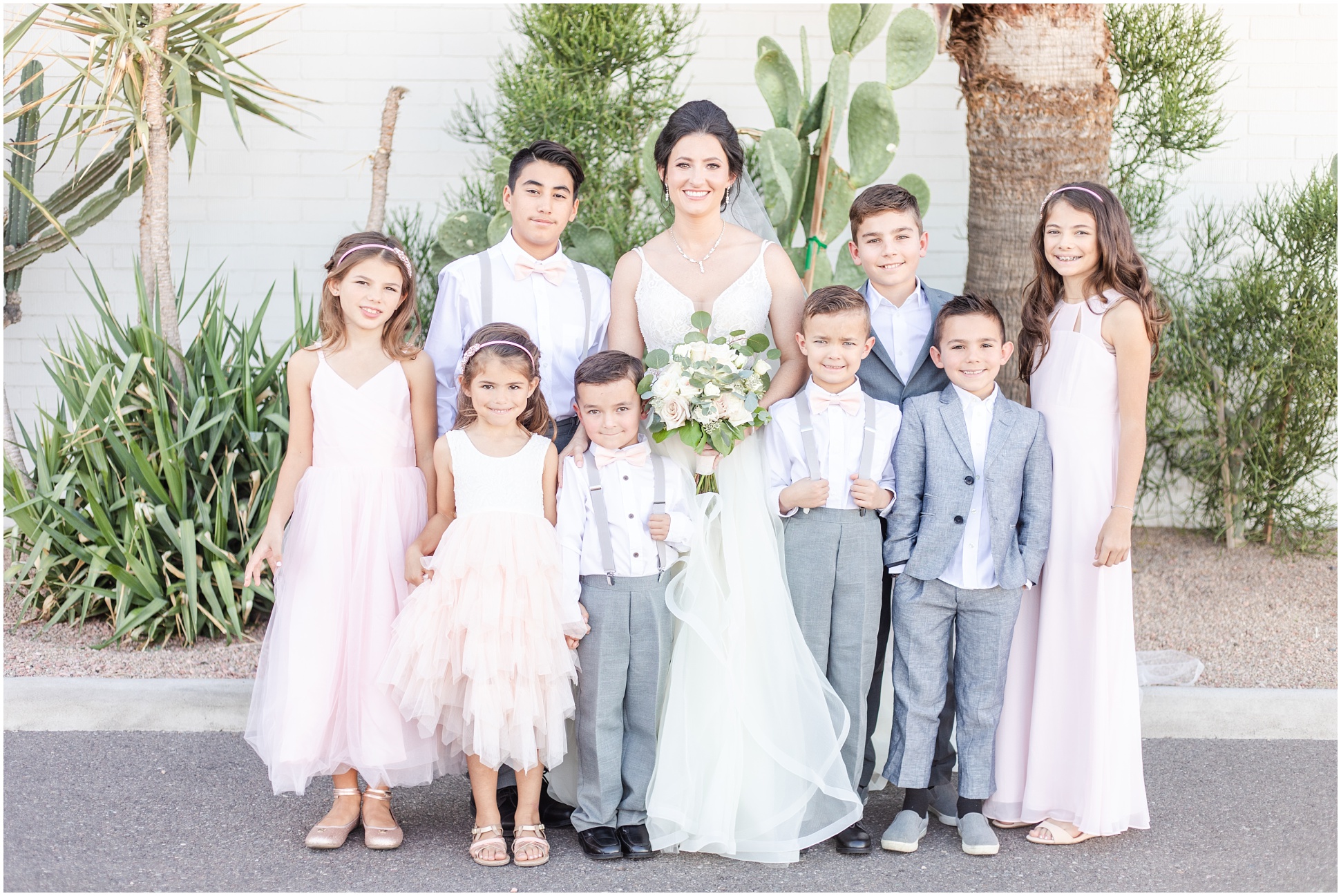 Bride surrounded by kid family members