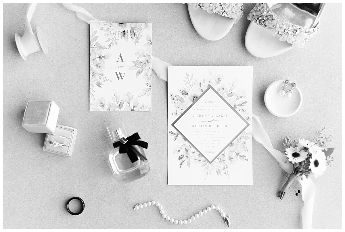 black and white flatlay of wedding details