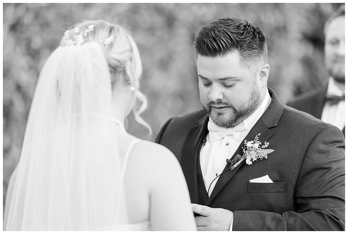 groom reading vows to the bride