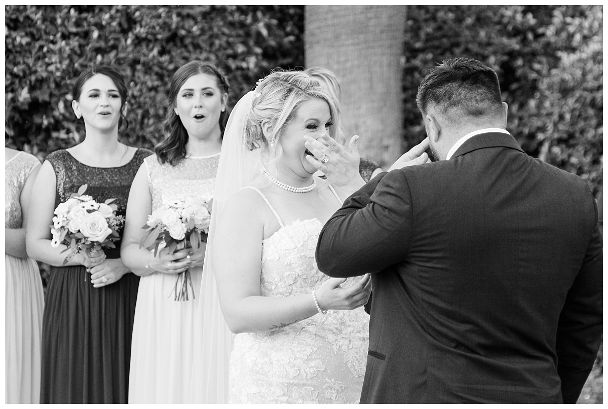 bride and groom crying while exchanging vows
