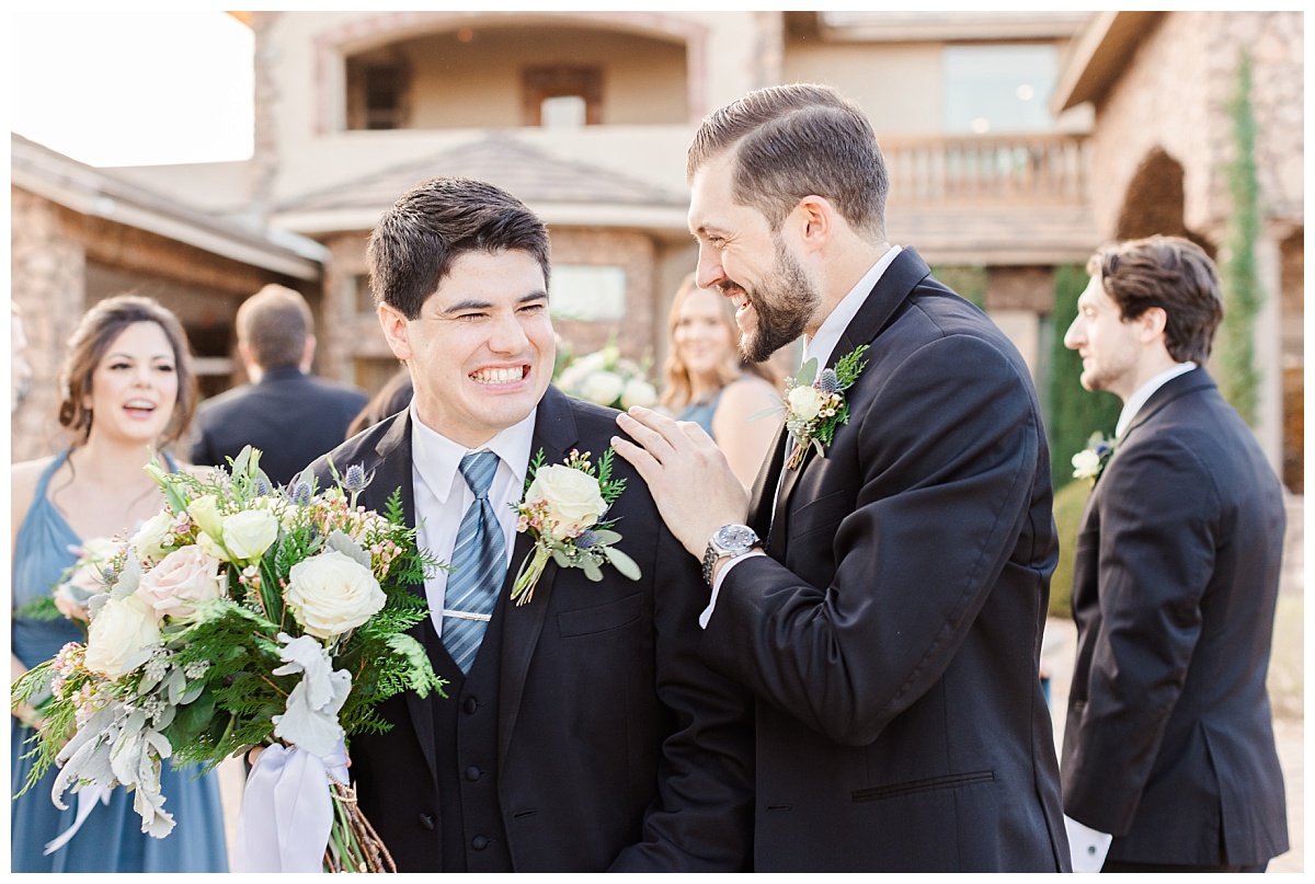 Groom and Groomsmen sharing a moment together
