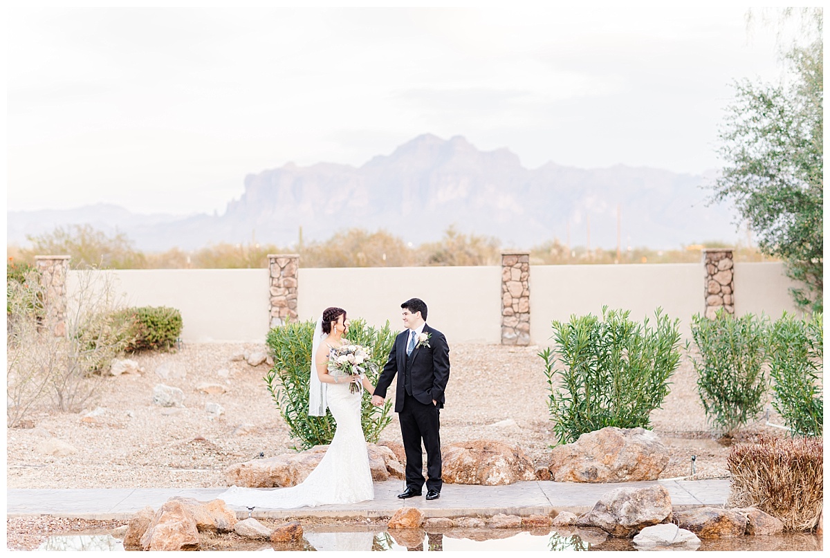 Bride and groom in front of Superstition Mountains