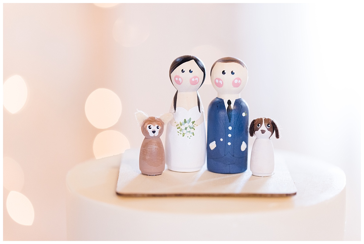 husband, wife, and puppy cake topper