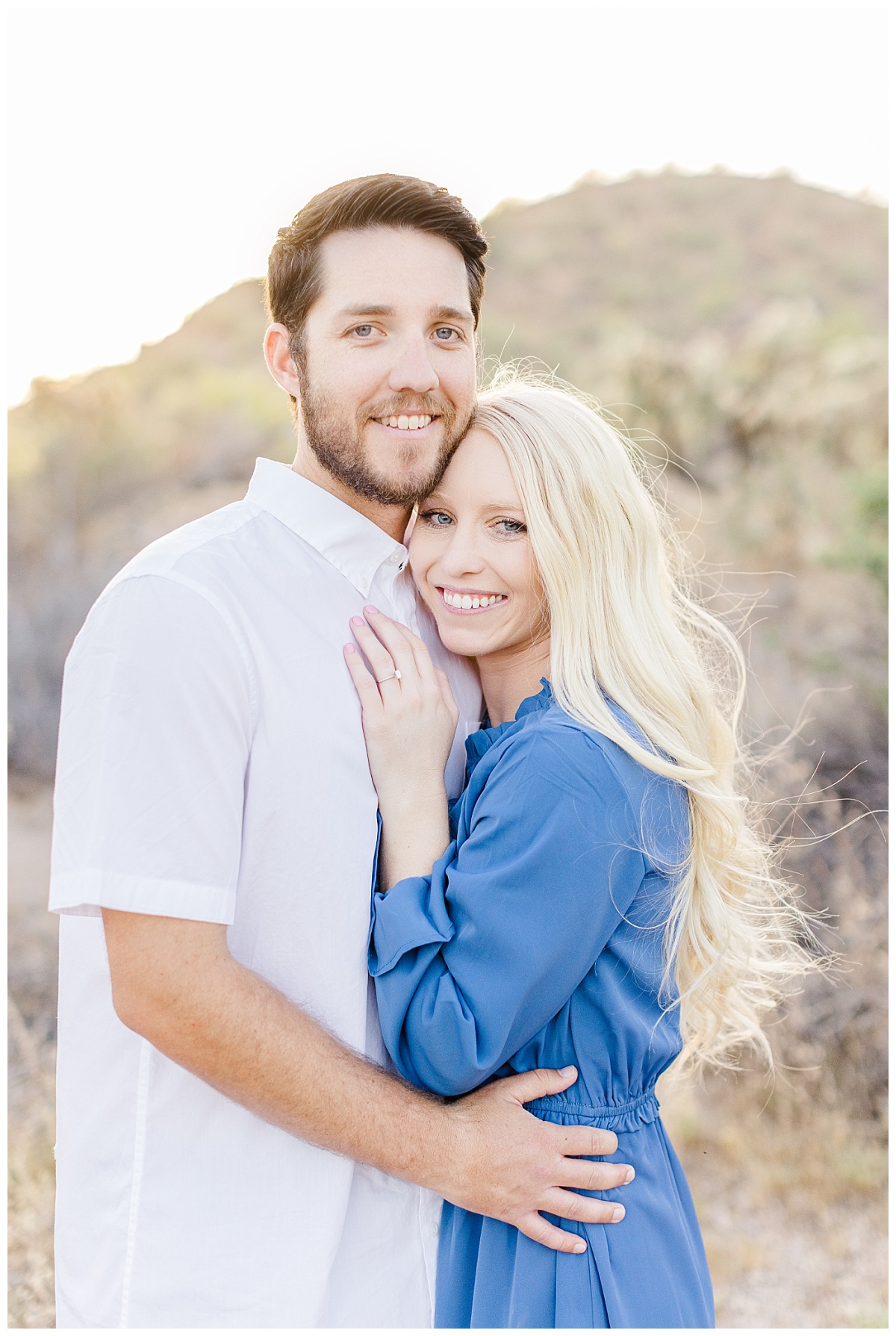 a couple chest to chest for their desert engagement session