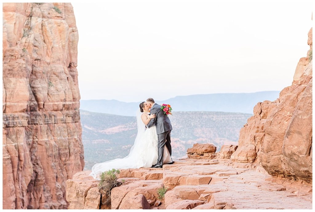 Bride and Groom sharing a dip kiss on Cathedral Rock.