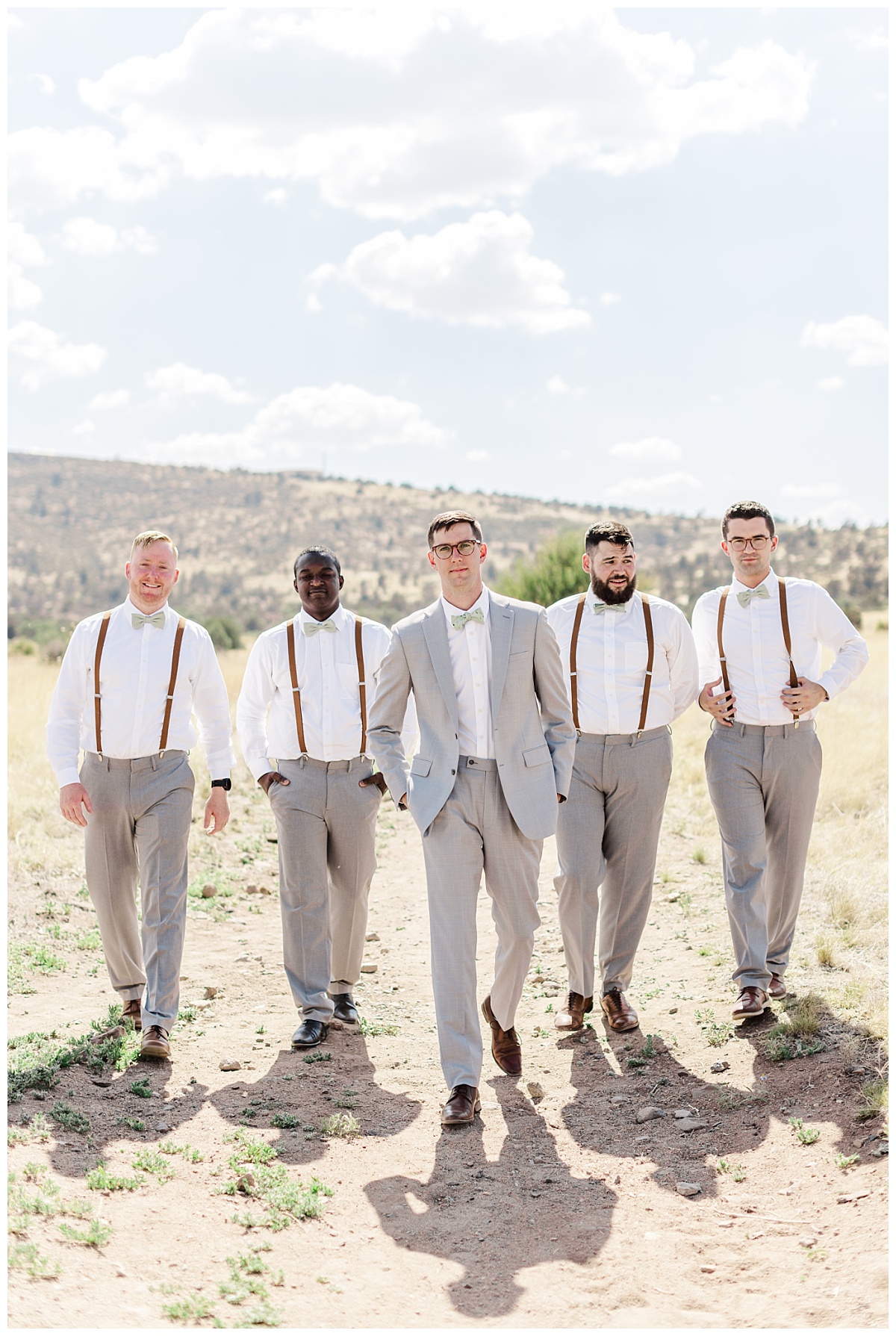 Jake with his four groomsmen in their gray suits