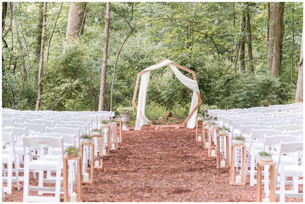Simply elegant ceremony site in forest clearing
