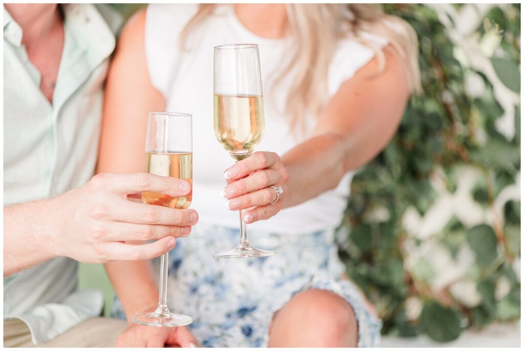 Close up of couple doing a cheers with champagne