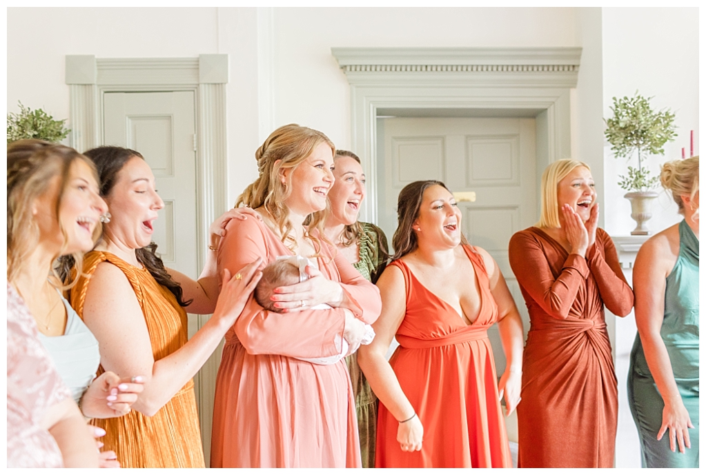 Julia doing a first look with her bridesmaids in the estate's bridal suite at The Stone Mill Inn, York, PA.