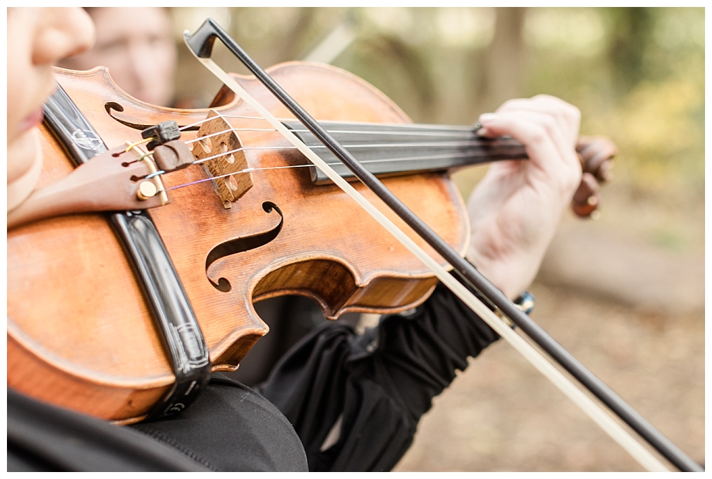 Close up shot of violin player's hands while playing