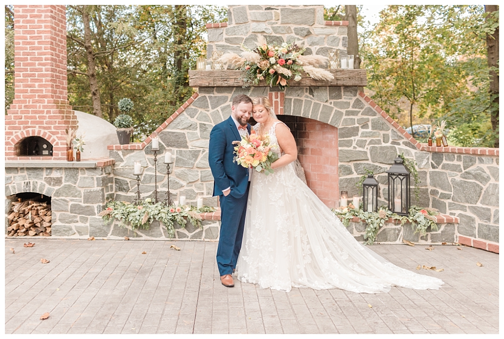Rustic autumn wedding - bride and groom on stone and brick patio