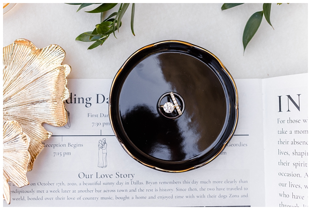 Rings in a black and gold ring dish
